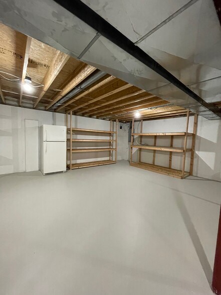 Extra refrigerator in basement - 2034 River Point Ct