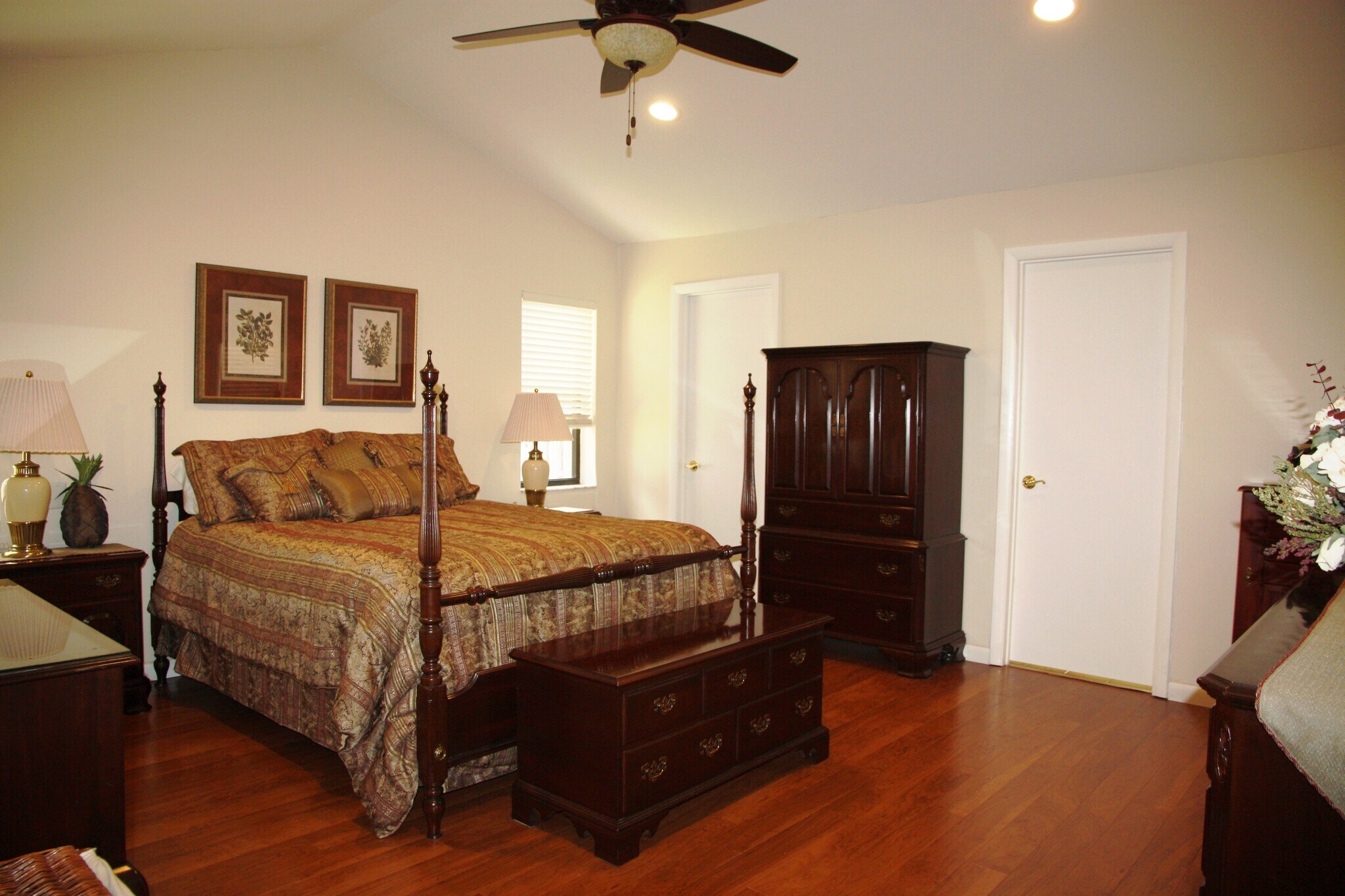 Master bedroom has huge walk-in closet and beautiful laminate wood floors. Master bath is on the right - 2662 NW 42nd St