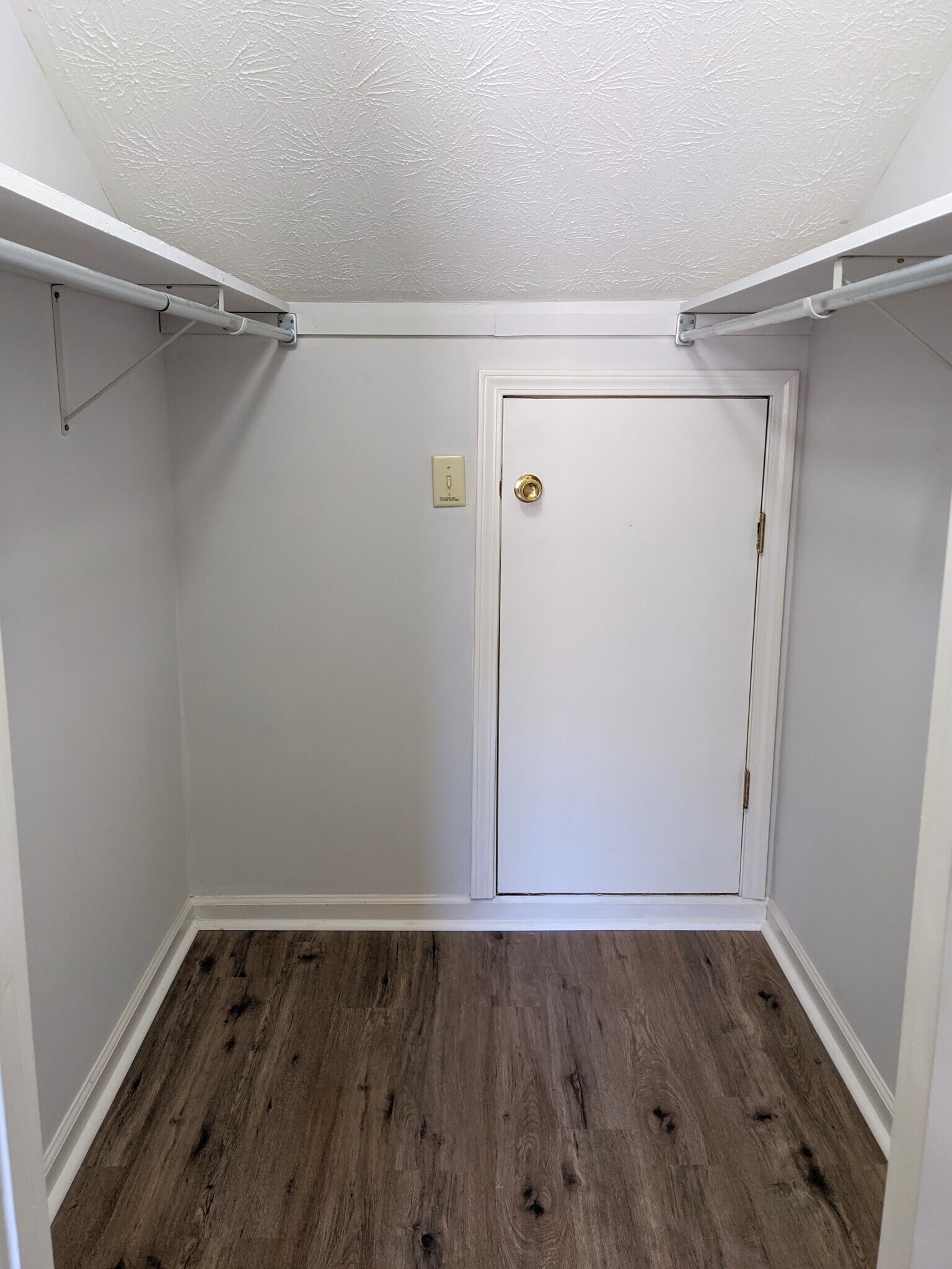 Left Bedroom, Large walk-in closet with access to storage area in eaves - 3221 Hunters Point Dr