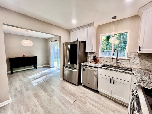 Building Photo - Come see this FULLY renovated two-story tr...