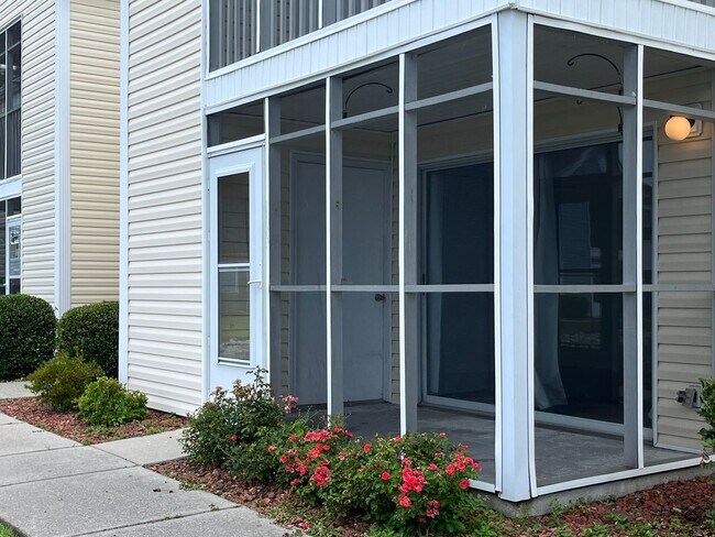 Building Photo - First Floor, Unfurnished, 3 Bedroom, 2 Bath Condo with Screened-in Back Patio!