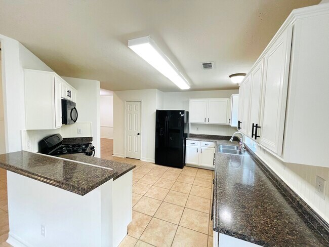 Open kitchen with large pantry - 14511 Enola Dr