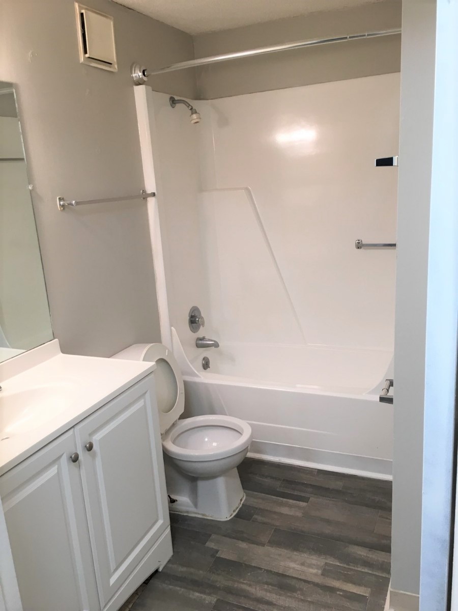 Bathroom in renovated unit. - The Village at Iris Glen