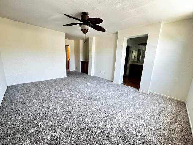 Building Photo - 4 bedroom home. New Carpet!