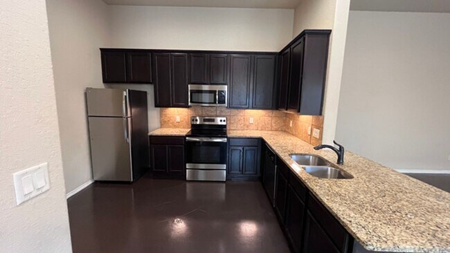 Building Photo - Granite Counters, High Ceilings & More – S...