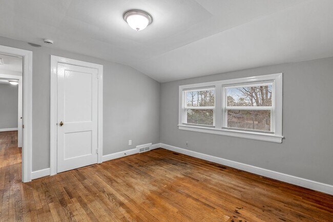 Building Photo - Brick home, Two Story, Hardwoods, DR, 2 Sun Rooms, FP, Carport!.