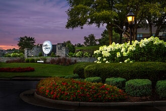 Park Place community entrance at dusk - Park Place Apartments