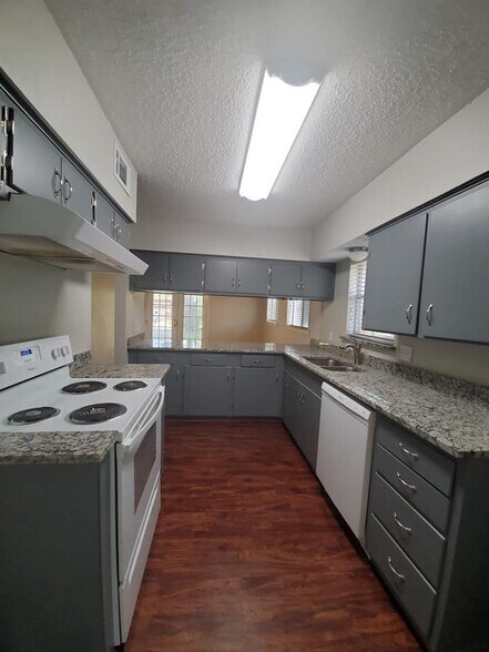 Granite counter tops &amp; new appliances! Look at that window over the sink. - 6450 Lontos