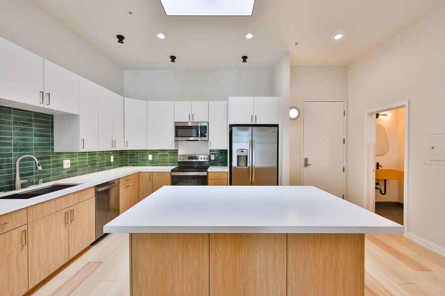 Kitchen and powder room to right - 3211 5th Ave