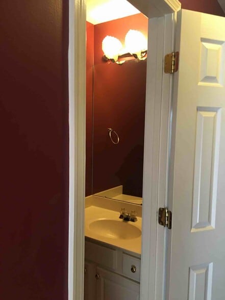 First floor 1/2 bath. - 7042 Mead Lane
