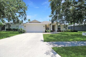 Building Photo - Annual rental: Spacious 3BR/2BA Creekwood Home with Office, Screened Lanai, EV Charger & Resort-S...