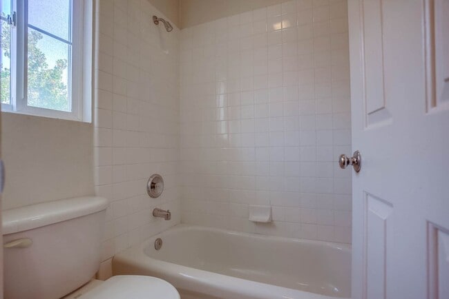 Building Photo - Available Now!! Spacious 4 Bedroom Plus a ...
