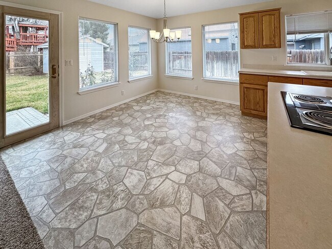 Building Photo - Spacious 3-Bedroom Home with 3-Car Garage, Fenced Yard & Easy Commute to Downtown Boise & BSU