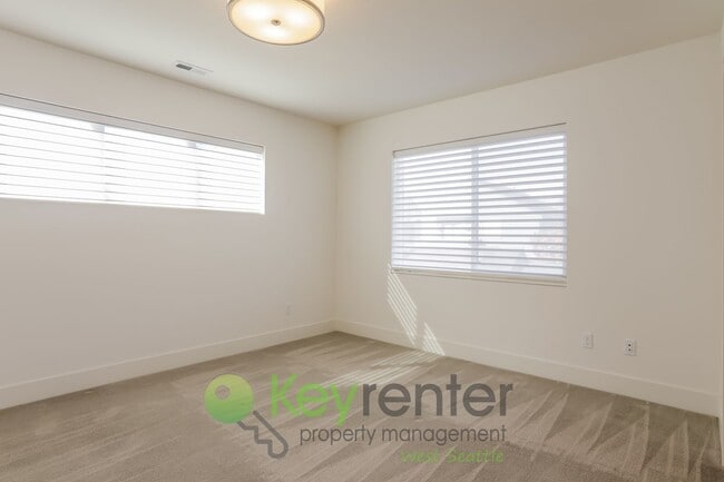 Building Photo - Spacious Living with Balconies, Deck, and Private Yard