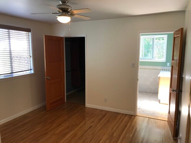 Master bedroom with original oak flooring, walk-in closet and private bathroom. - 14911 Fonthill Ave