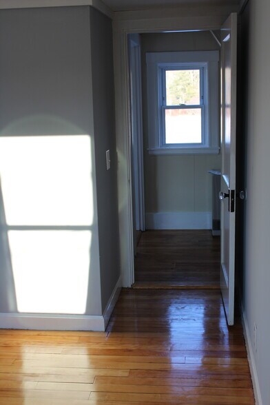 Looking from the Master bedroom to the hall - window looks out in the back yard. - 1011 Main St