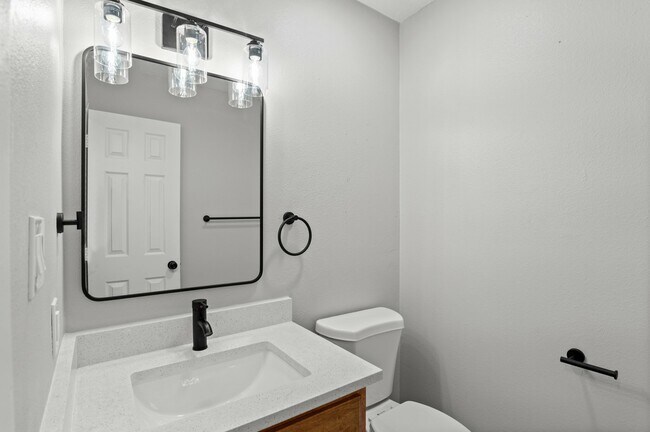 Experience elegance in this contemporary bathroom featuring modern finishes. - 5580 West 4th Avenue Townhomes