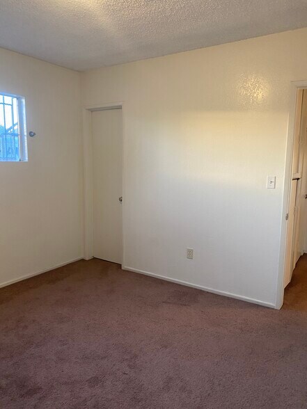Bedroom #2; new carpet, door to walk-in closet - 2458 S Normandie Ave