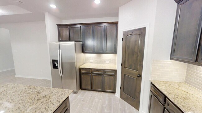 Building Photo - Welcome home to this beautifully designed 4-bedroom, 2.5-bathroom gem!