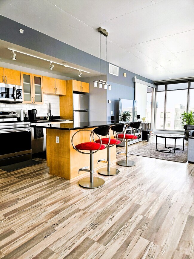 Kitchen and living area flows together - 8161 33rd Ave S