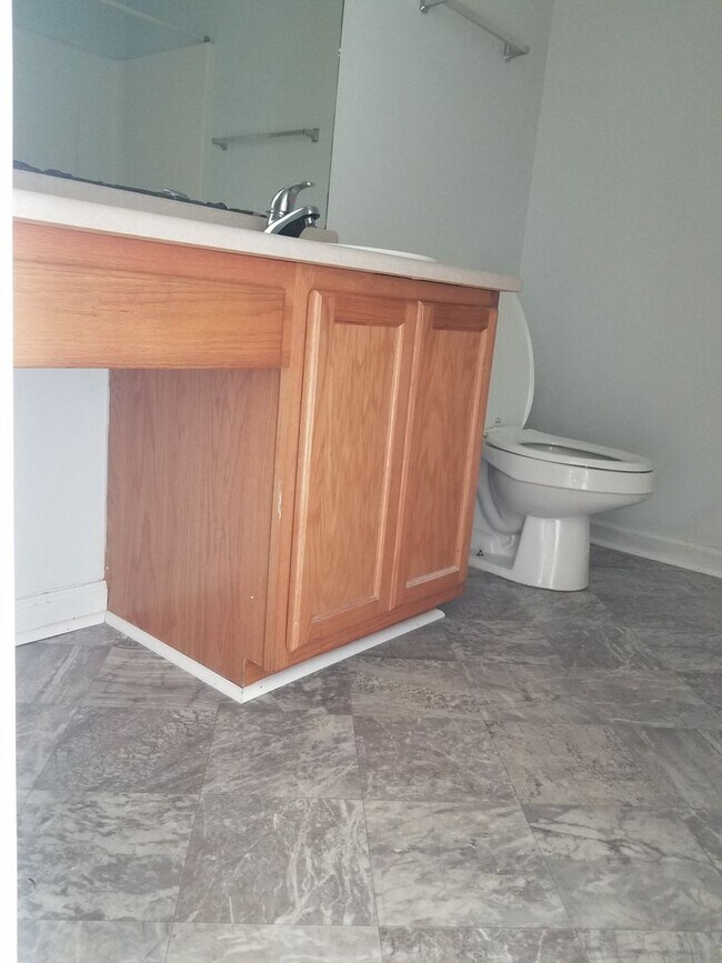 Building Photo - 1/2 off First Month Rent home has new flooring throughout.