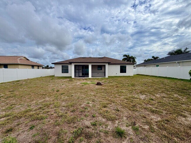 Building Photo - Move-In Ready 3BR Home in SW Cape Coral with Fenced Yar+Screened Lanai+Lawn Care Included+Pet Fri...