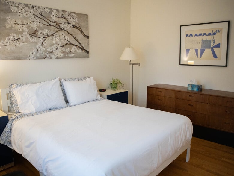 Master Bedroom with Queen bed, dresser, two nightstands, two lamps, and two closets. - 2018 Lake St