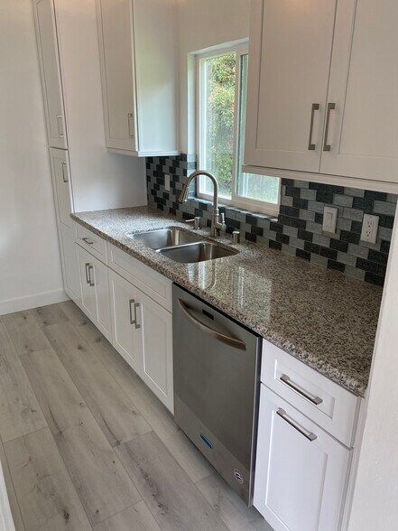 Wonderful granite tiled kitchen with peaceful view of nature. - 1859 1/2 Pandora Ave