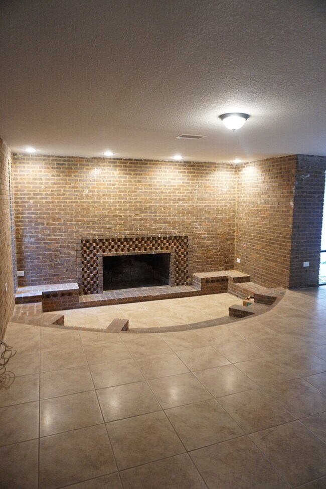 Building Photo - Four Bed - Three Bath - Large Storage Area...
