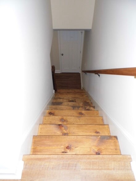 Beautiful hardwood stairs lead to the temperate sleeping and bathing area - 2312-A Belle Ave NE