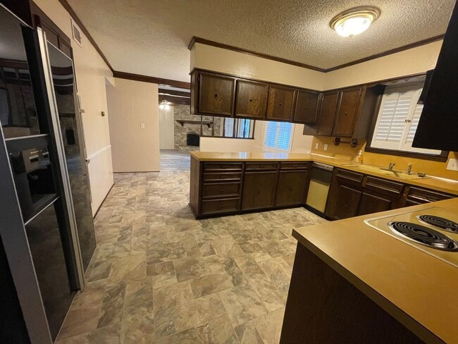 Building Photo - Lovely Two-Story Brick Home Located In "Western Hills" Off Pines Road