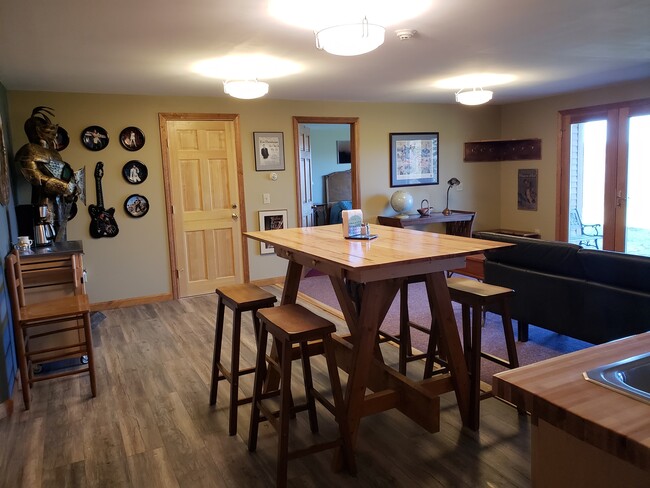 view of kitchen/dining from bathroom entrance area - 673 Winch Hill Rd