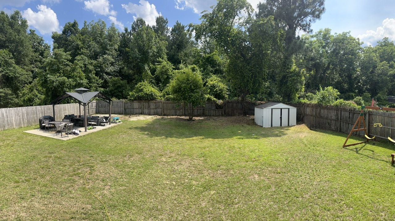 Backyard from deck - 301 Silver Oaks Dr