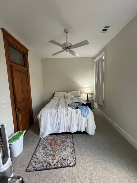 First bedroom with queen size, bed and walk-in closet. - 938 W Newport Ave