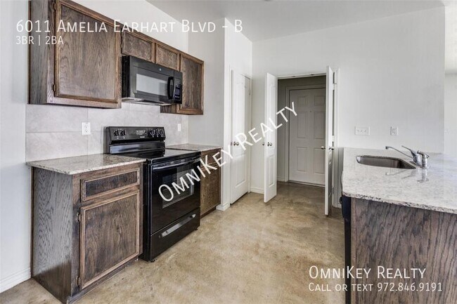 Building Photo - 6011 Amelia Earhart Blvd