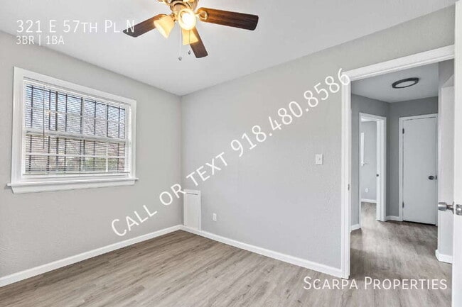 Building Photo - 321 E 57th Pl N