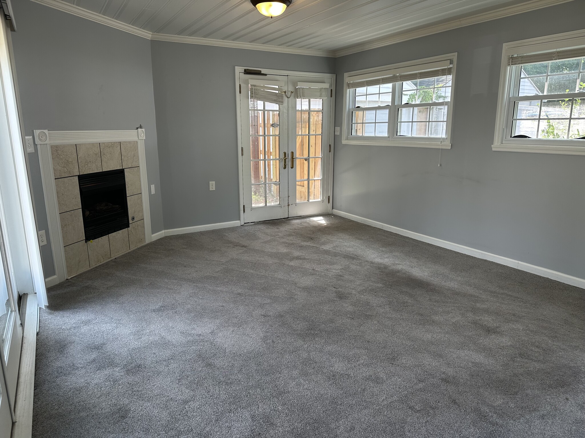 French doors and windows add more light to family room. - 5101 Boulevard Pl