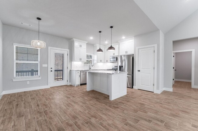 Building Photo - Welcome to this stunning 3-bedroom, 2-bathroom home that boasts a range of high-quality features ...