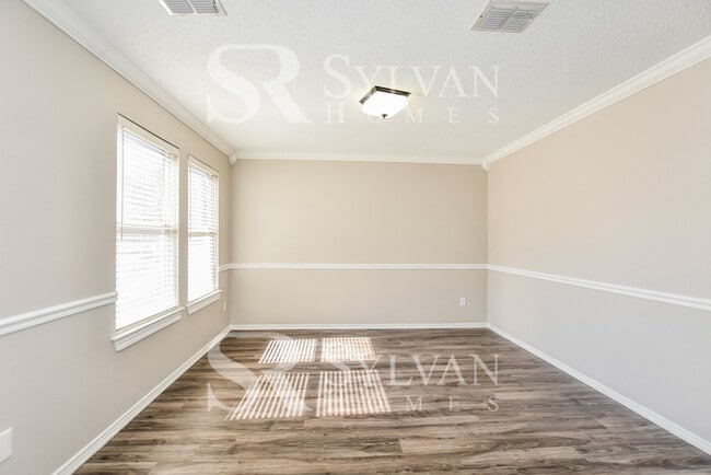 Building Photo - The living is easy in this gorgeous 4BR, 2.5BA brick home