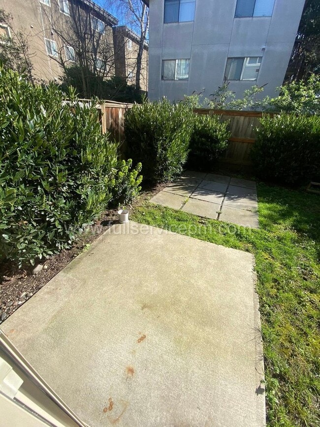 Building Photo - Spacious townhome with private backyard, garage parking, multiple decks, and a dedicated home off...
