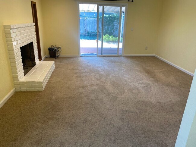 Building Photo - Spacious 1,196 Square Foot  4BR Home Across from Technology High School | Large Yard & 2-Car Garage"