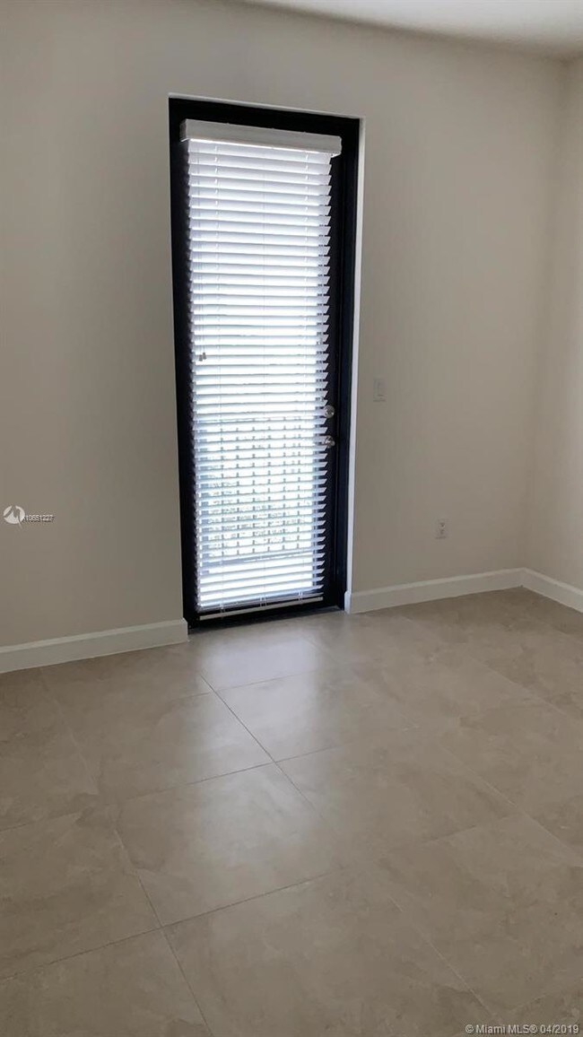 Building Photo - 6175 NW 104th Ct