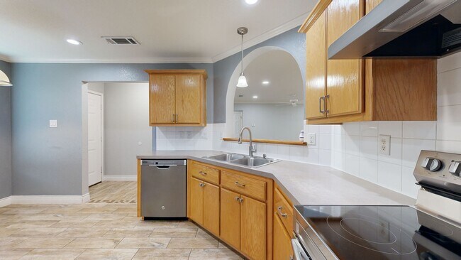 Building Photo - Completely repainted 4 bedroom ALL TILE ho...