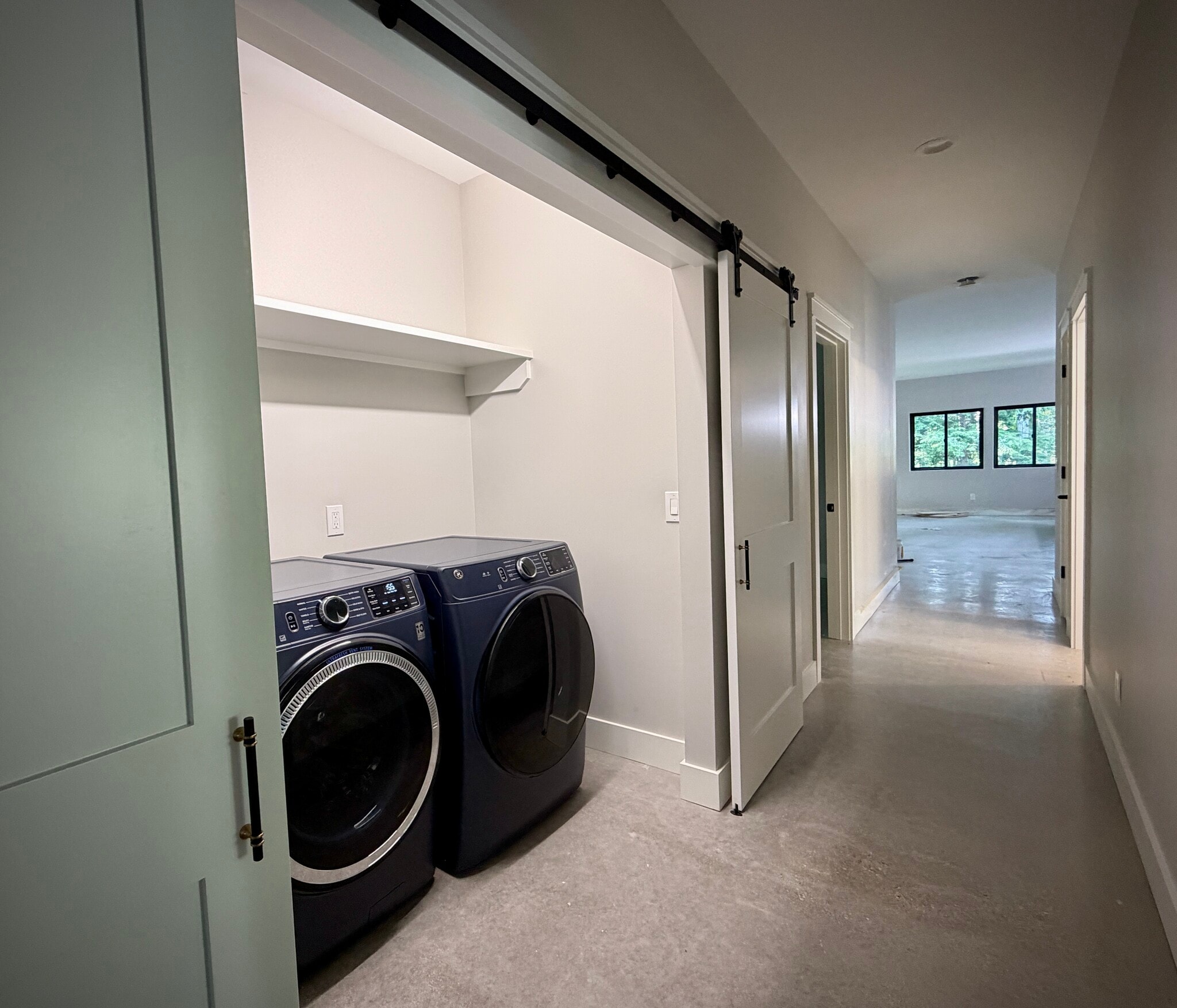 Brand new, high efficiency washer & dryer tucked away behind sliding barn doors - 10671 US 31