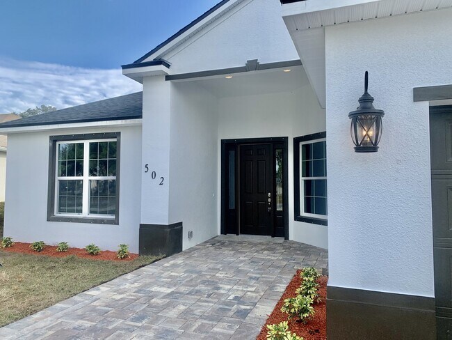 Building Photo - "Spacious 4-Bedroom 3-Bath with In-Law Suite & Granite Finishes in Palm Bay!"