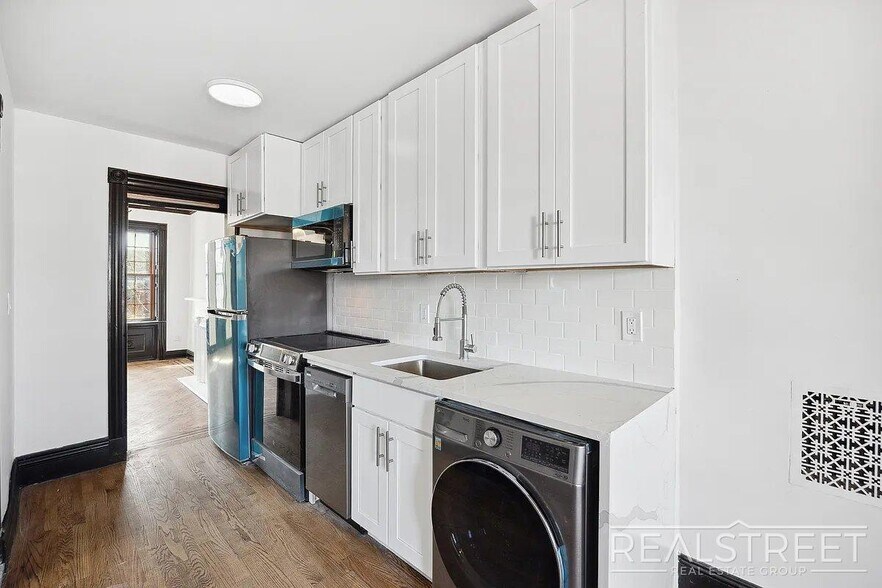 Building Photo - Timelessly Renovated Historic Triplex with...