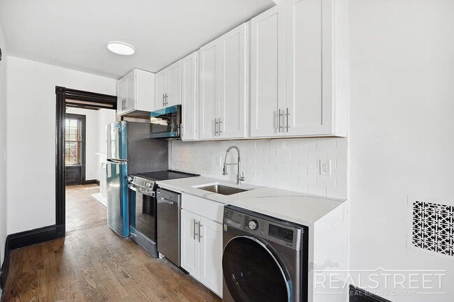 Building Photo - Timelessly Renovated Historic Triplex with...