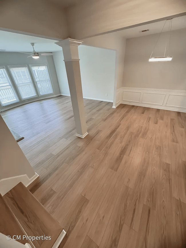 Great natural light in the main living room and dining room area. New floor thoroughout. - 3968 Boston Common St