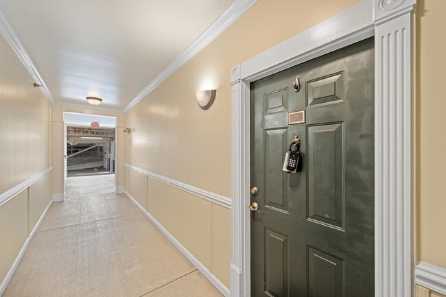 Building Photo - Two-bedroom, two-bathroom model with a den, located on the third floor.