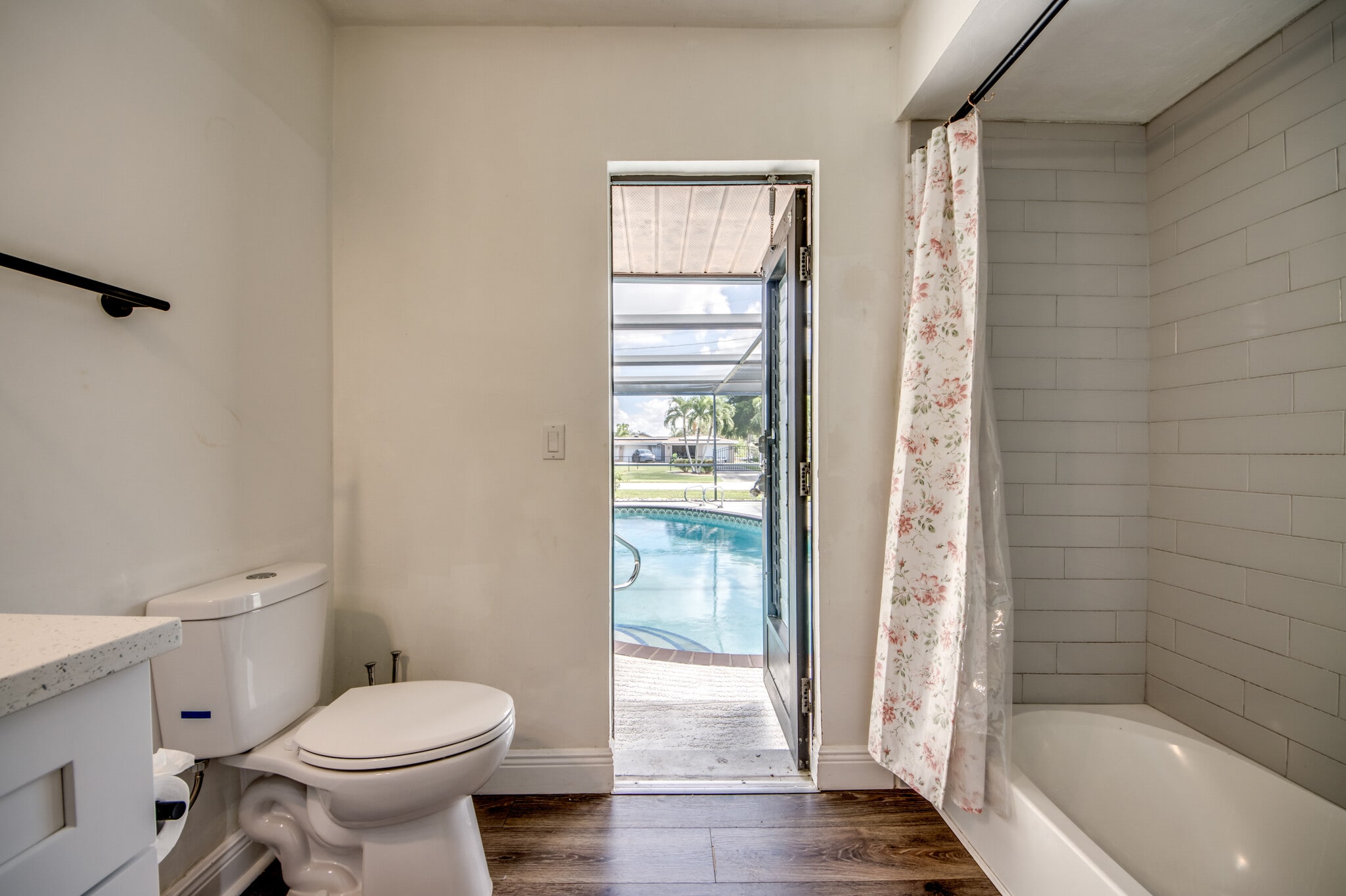 Newly tiles guest/pool bathroom has tub and shower combo. - 2316 Everest Pky